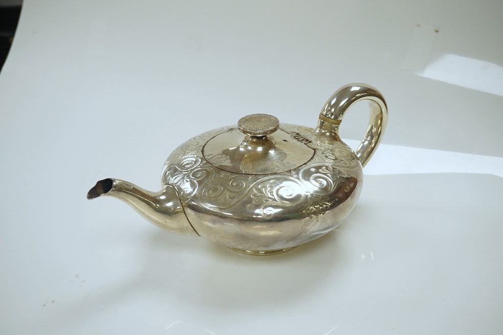 A Victorian silver bachelor's squat circular teapot, indistinct maker's mark, London, 1845, gross weight 13.8oz. CITES Submission reference XJ224VHB. Condition - fair